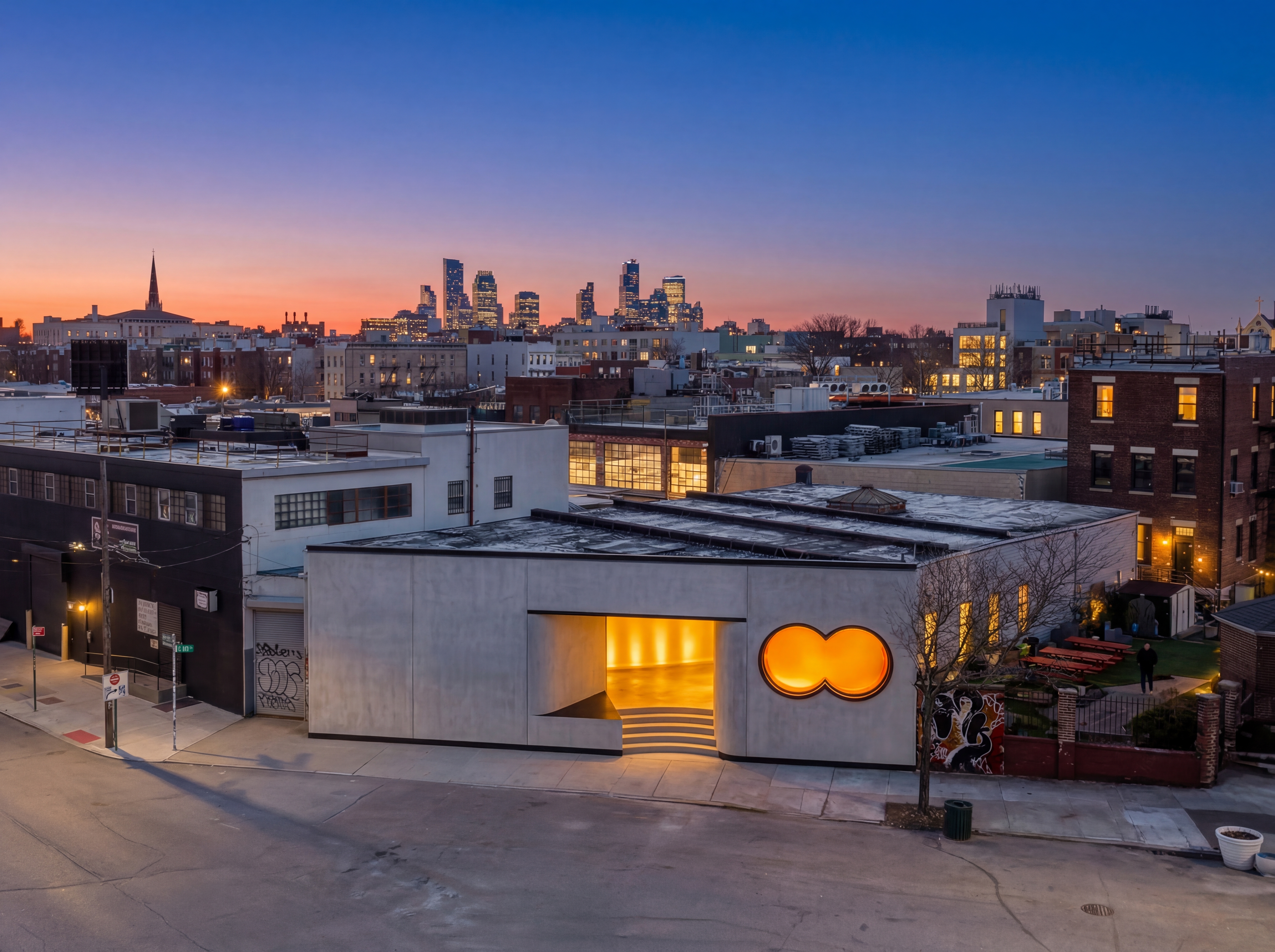 The Round music venue with Brooklyn skyline at sunset